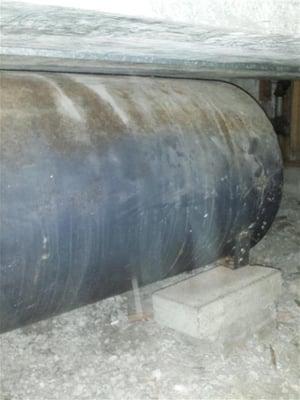 Old oil storage tank found in crawl space