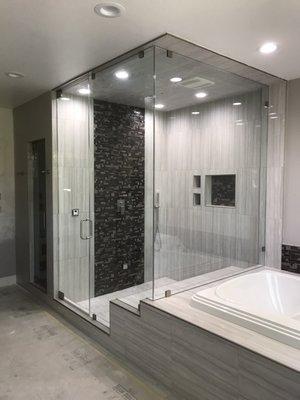 Custom steam shower enclosure- 1/2" frameless glass, 104" tall.