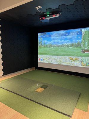 Uneekor Eye XO2 Simulators with fairway, rough, and sand hitting mats. Running E6 Connect with over 100+ courses available.