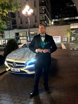 Husband next to a Mercedes. AI generated.