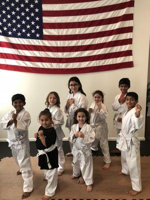 Here are some of our white belt students posing after a great class!