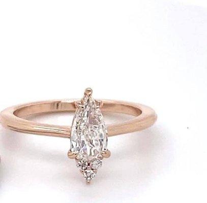 Custom designed 14k rose gold with pear and round diamonds. Tina Yancey