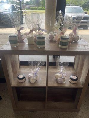 Cute gift sets and several different scented candles and bath bombs.