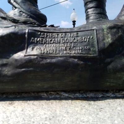 plaque on the cast bronze statue