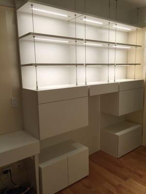 Custom unit w/steel cable, LED lighting, storage and lateral file drawer.