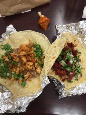 One taco with chicken, one al pastor. Total $3.90