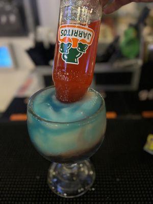 Shark attack. Blue curaçao, margarita and jarritos fruit punch