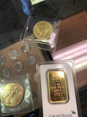 Some LNGS staples. Top: 1oz, gold Canadian maple leaf (.9999fine), Left: 1 oz American Gold Eagle; Right: 1oz Credit Suisse Gold Bar