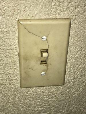 The main light switch for the room. Clearly dirty