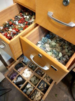 Some drawers containing just a few of the terrarium fillers offered by this store