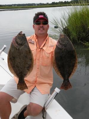 Capt. Jot with two very nice Wrightsville Beach Flounder caught on one of his fishing charters.