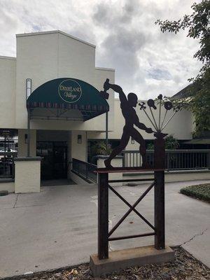 Statue of Man at Work in front of rear entrance