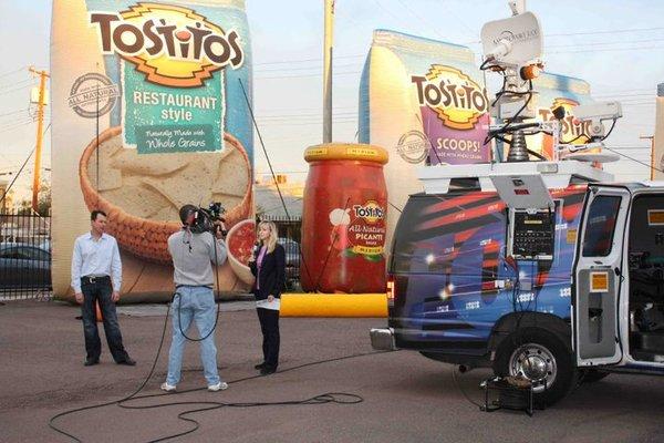 Fox 10 shooting in front of our Tostitos inflatables.