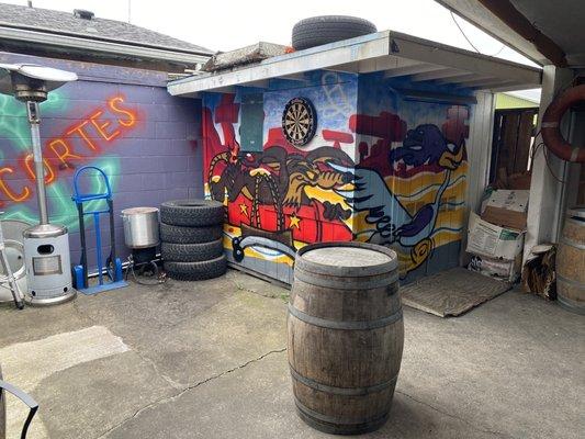 Outdoor covered smoking area with tv's