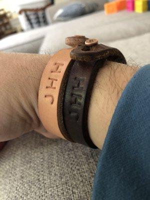 Handcrafted leather bracelets with copper buttons and branded monograms