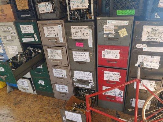 File cabinet drawers labeled with the parts and organized by size. You can go through them yourself.