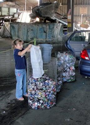 My daughter getting her cans ready for the scale.