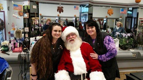 Michelle and Donna trimming Santa