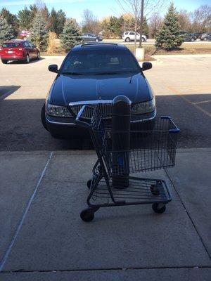 At Walgreens and find  Naperville taxi driver decides he need 2 parking spots leaves car running cigarette burning on hood .