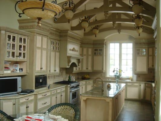 Design of New kitchen with 15'-0" ceilings enhanced by decorative wood cedar truss work. Furniture selection in progress.