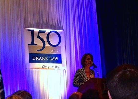 Receiving Alumna of the Year award at Drake Law School