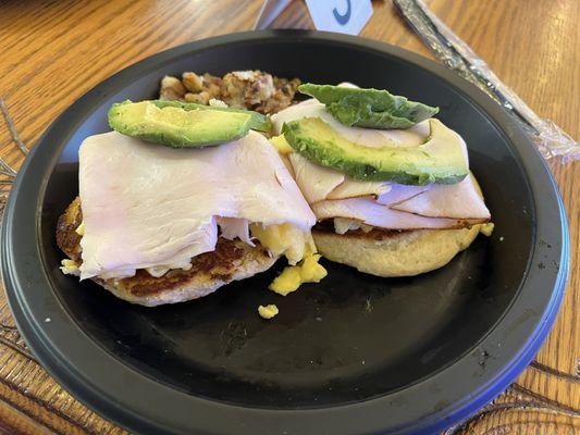 Biscuit with eggs, turkey, and avocado