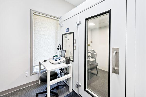 Wheelchair accessible sound booths with large windows in each testing room.