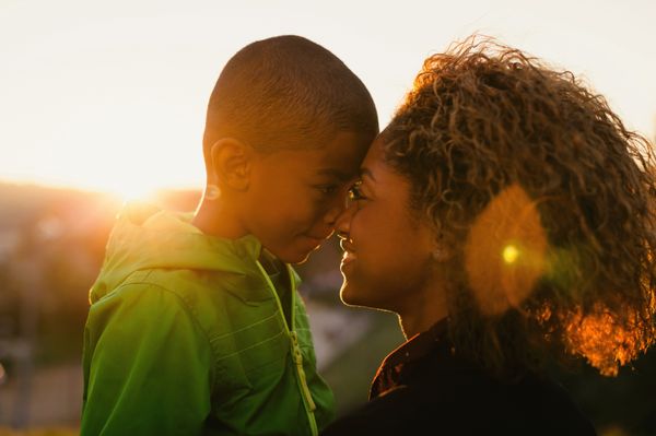 A mother and son at sunset.