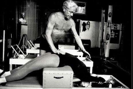 Joseph H. Pilates instructing his client on the Short Box Series on the reformer in his NYC studio.