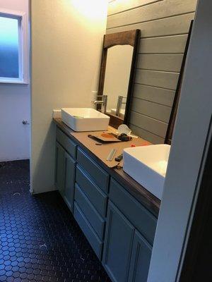 Vanity remodel with butcherblock counter, hexagon tile floor