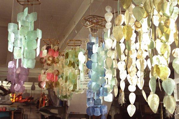 Whimsical Wind Chimes hang all throughout the store to show off their beauty when the sunlight hits them!