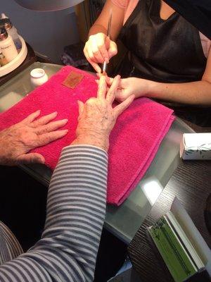 Mommy is getting her nails done.