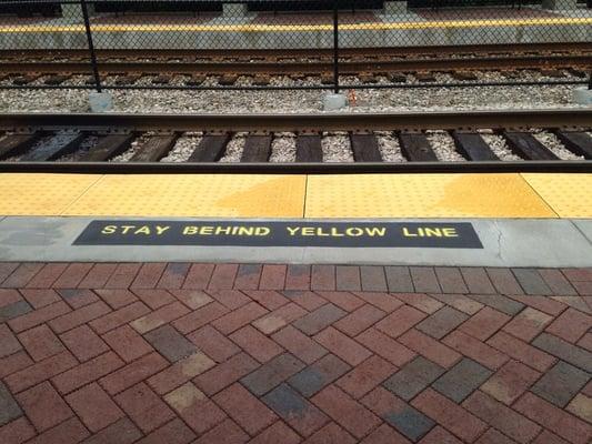 Think safety: stay behind the yellow line