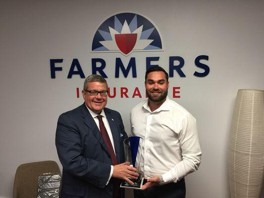 Rob Irwin presenting me with the Blue Vase award for excellence in life insurance