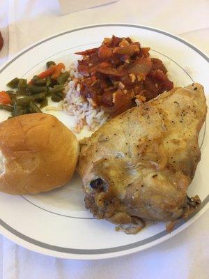 The meal. Baked chicken, string beans, gumbo over rice, and a roll.