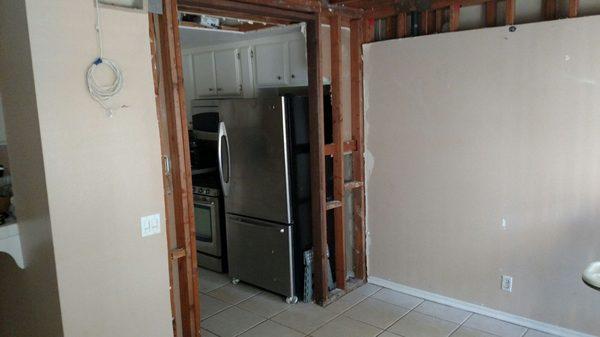 Before, kitchen entry/ceiling gutted