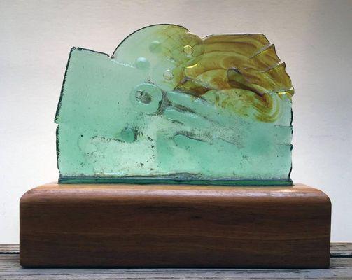 Recycled glass sculpture on wood base, by Hawaii artist J. Jay West.