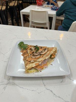 breakfast crepe, mushroom, tomato, spinach, ham, egg topped off with chipotle sauce