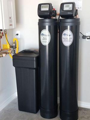 New Water Softner with matching whole house filtration system.