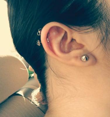 Two piercings on cartilage.