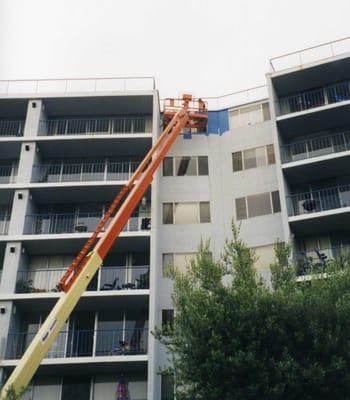 Exterior painting of Marina View Apartment building.