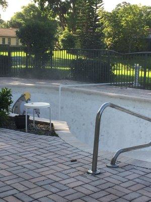 Sandblasting a pool for remodel.