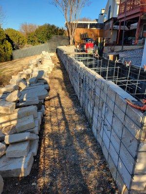 Another view of completed wall with all the left over stone - see text for why.