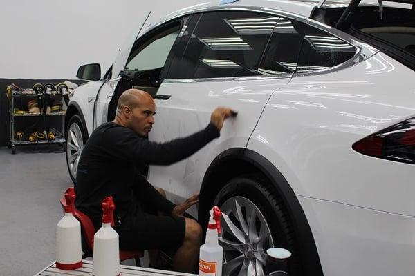 Tesla Model X receiving a full car wrap with Xpel Ultimate paint protective film aka Clear Bra