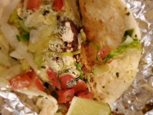 Nothing but cabbage, a cut up lime, and slivers of tomato. One small piece if meat.