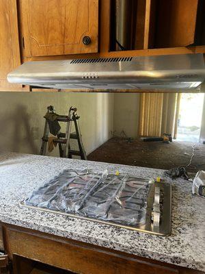 Demolition, installation new tile, recessed light, countertop, stove, fan