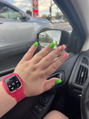 Short green nails with design by Nini