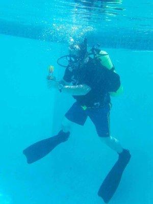 Open Water Instructor playing in the pool during training session.