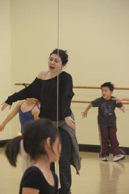 Kids burning serious energy in hip hop class.