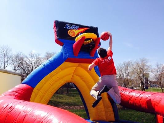 Fun Inflatables & Party Rentals, such as this interactive sports slam dunk basketball inflatable.